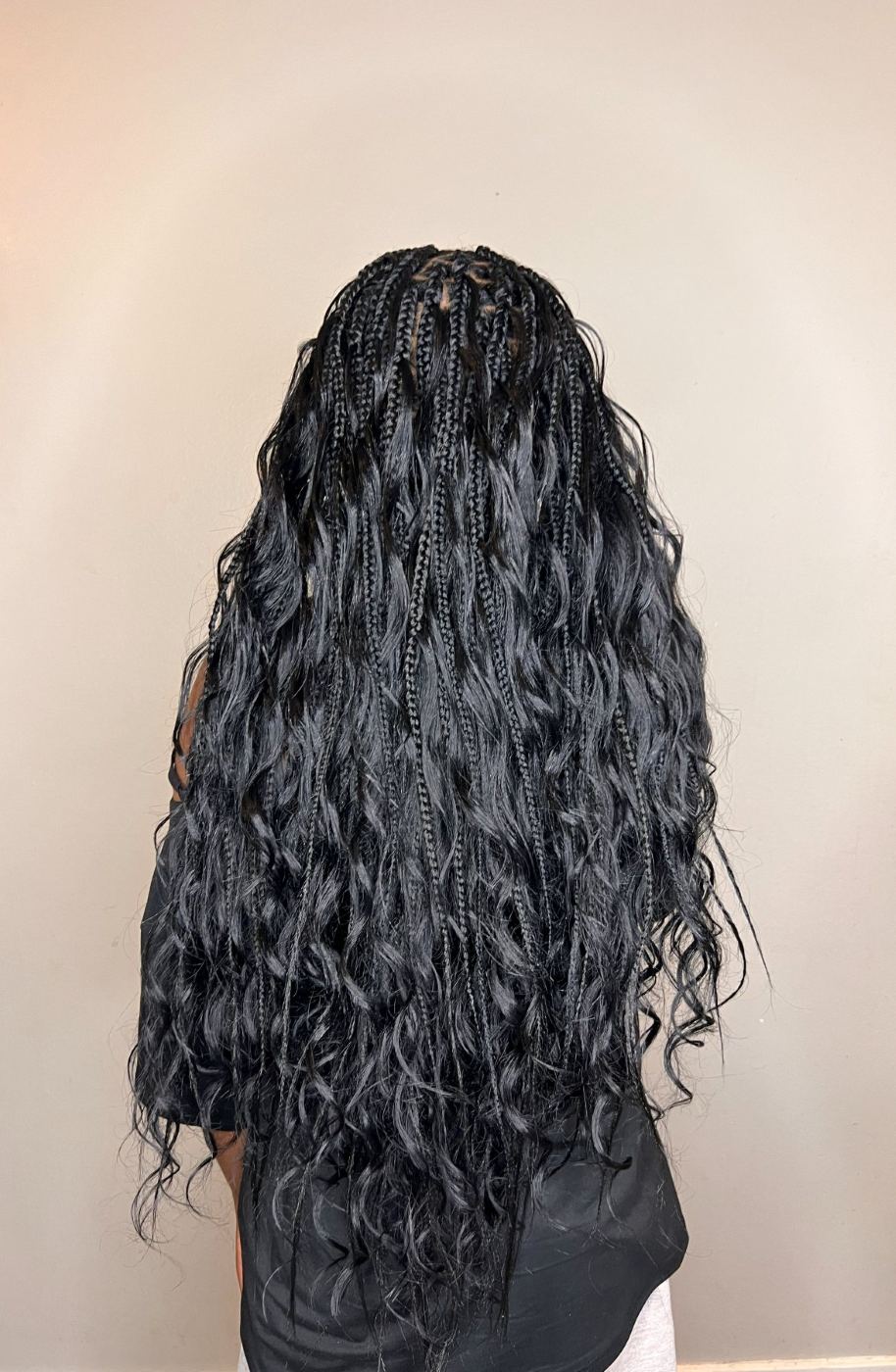 Waist-length boho knotless braids in silver-grey with loose wavy ends