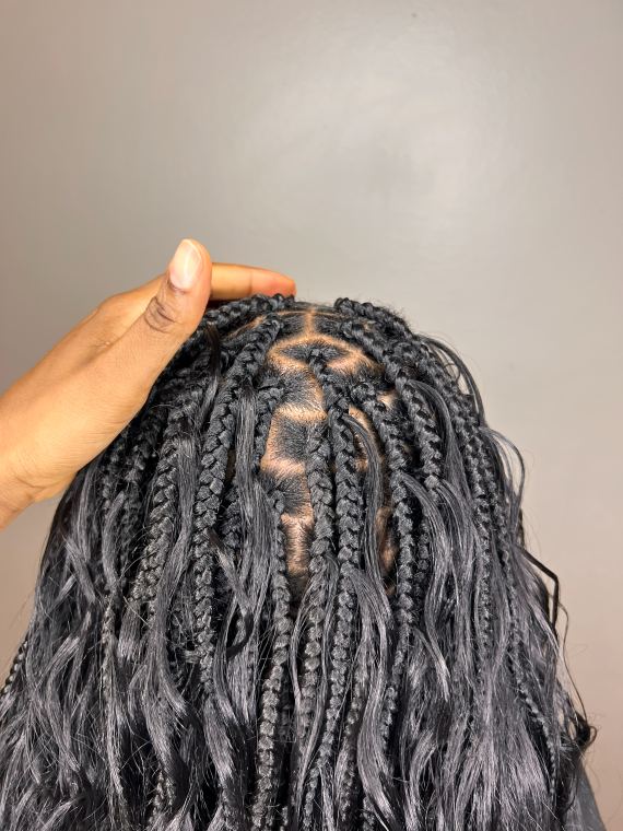 Overhead detail of grey boho knotless braids with diamond parting