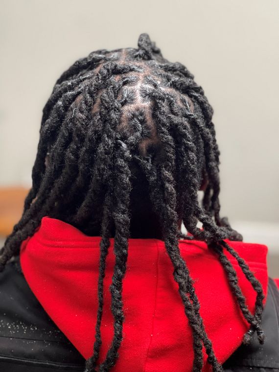 Two-strand twists with a defined crown parting